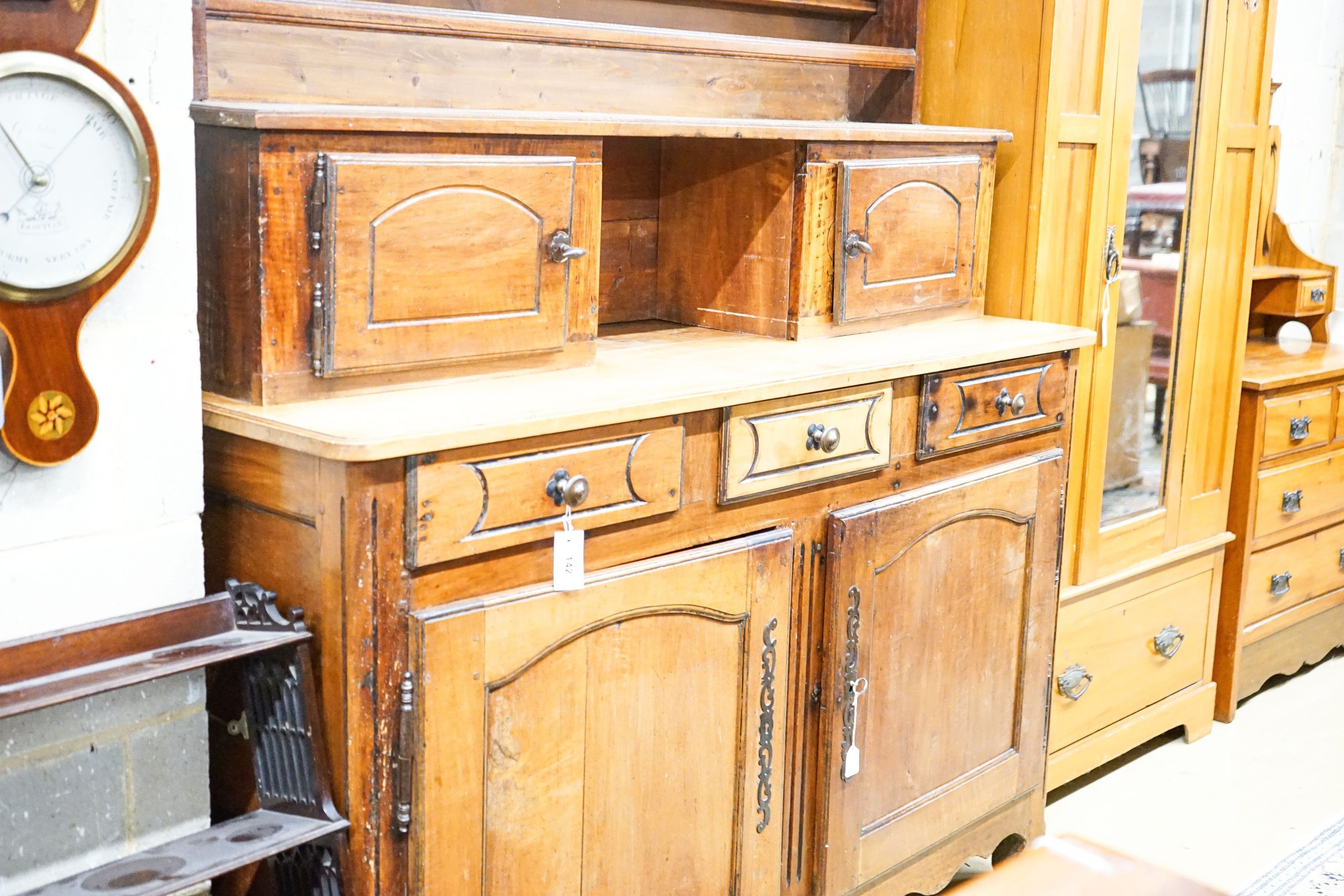 A late 18th / early 19th century French fruitwood dresser, length 160cm, depth 57cm, height 240cm